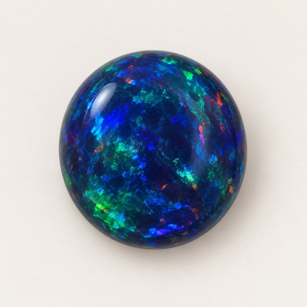 Black lab-grown opal, round cabochon