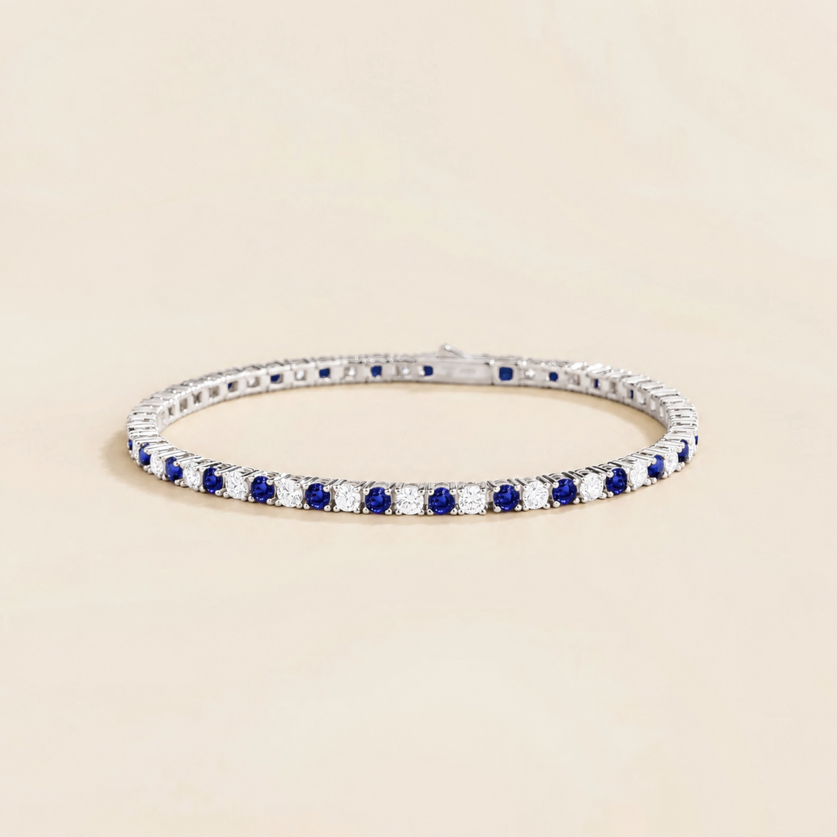Stacy blue sapphire & diamond round tennis bracelet in white gold