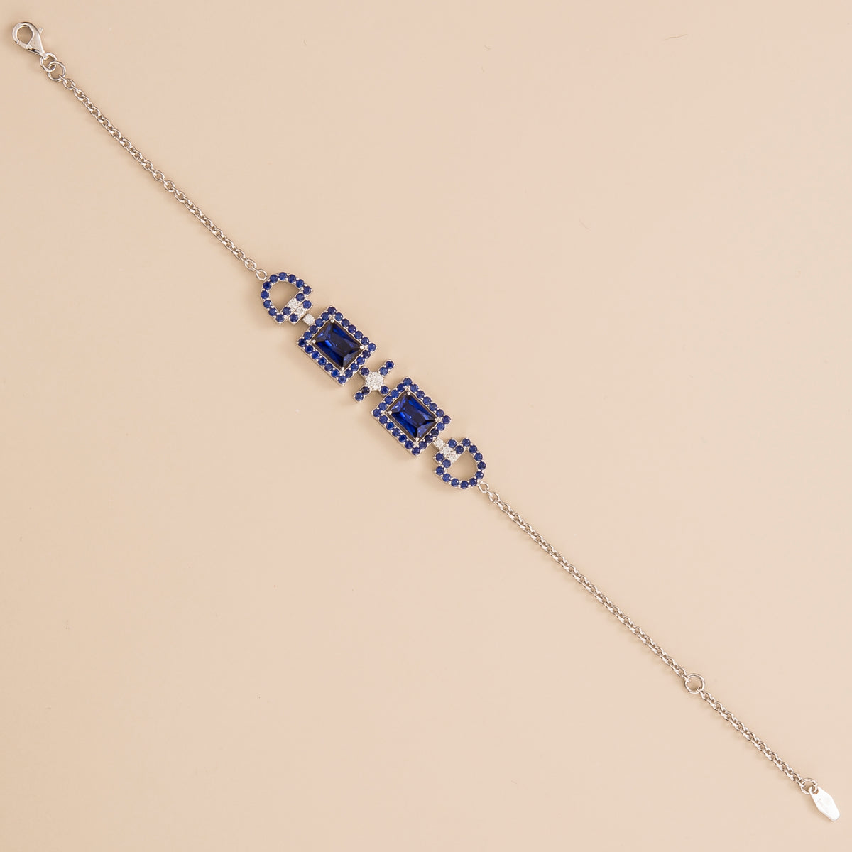 Ciceris blue sapphire Art Deco halo bracelet in white gold, two emerald-cut lab-grown sapphires with diamonds, full length | Juvetti London