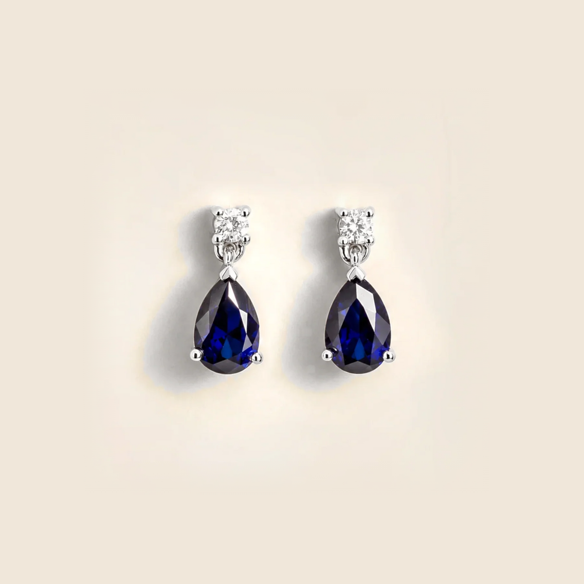 Lab-grown blue sapphire and diamond pear drop earrings in white gold – front view | Pisa by Juvetti