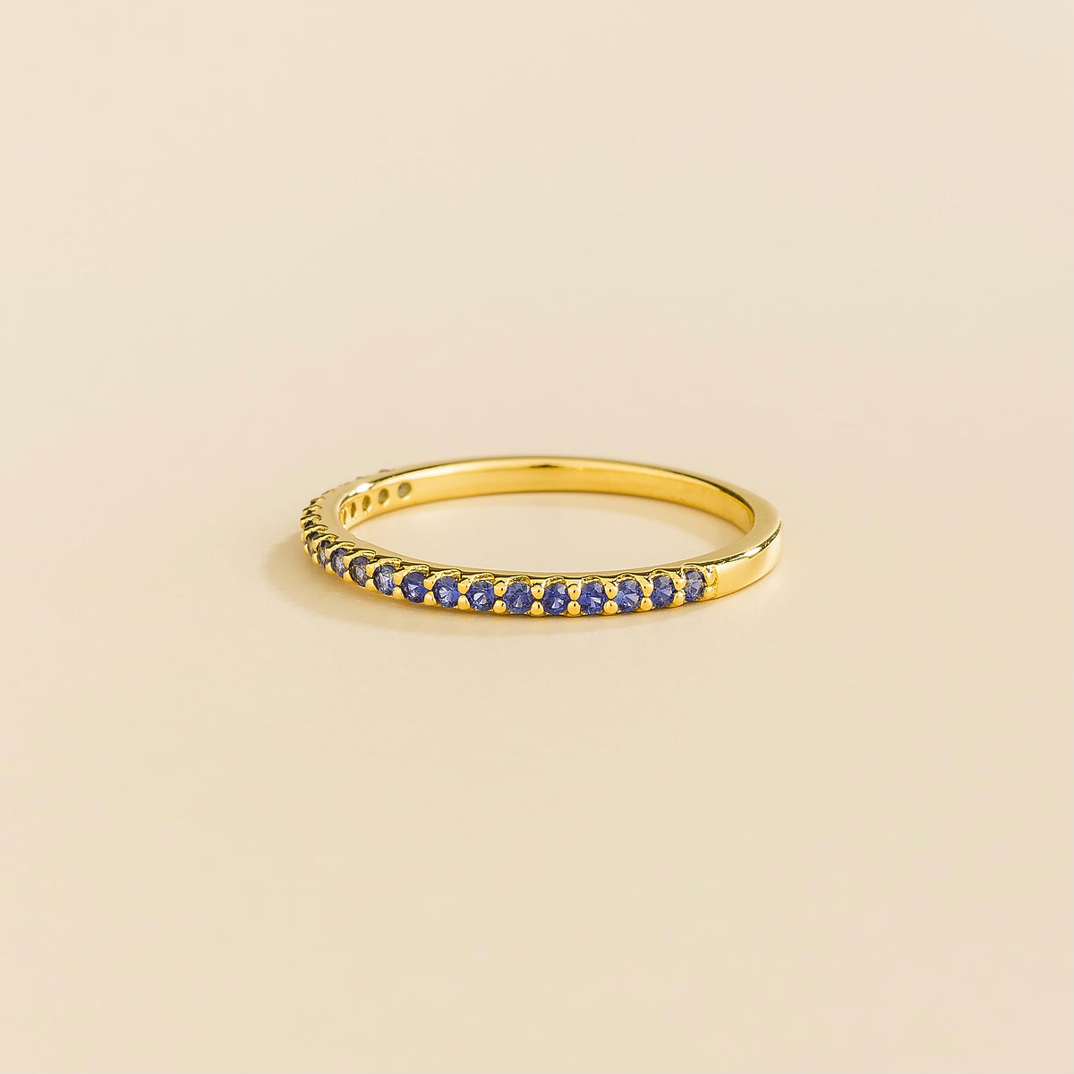 Stacy Blue Sapphire Half Eternity Band in Gold – angle view