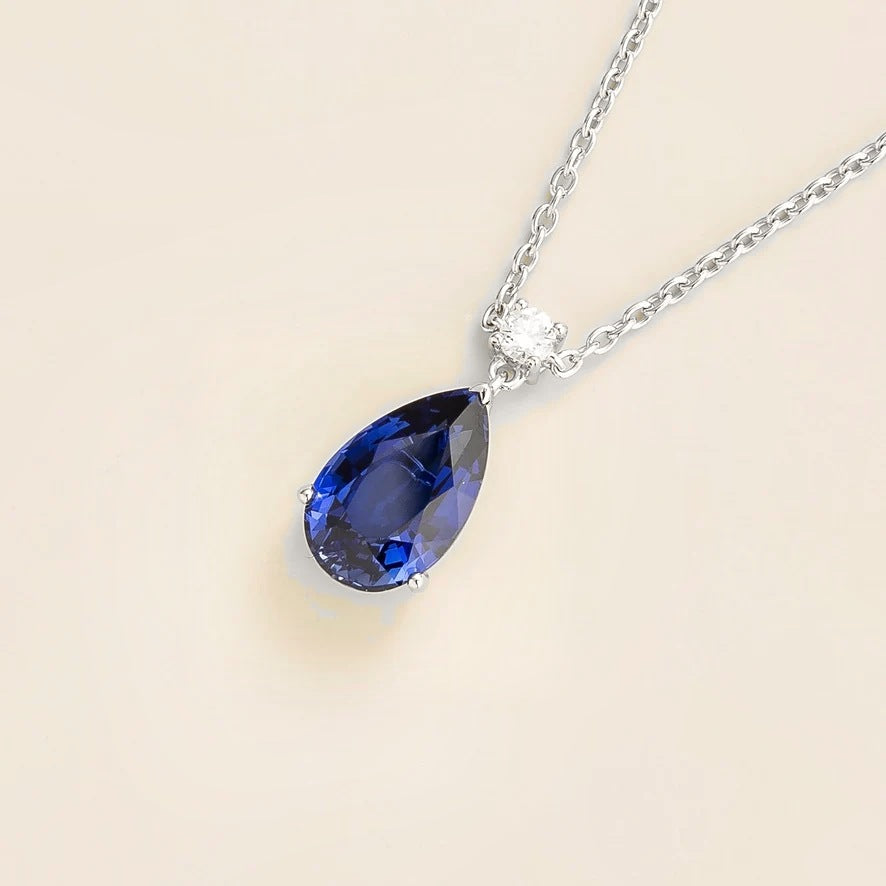 Lab-grown blue sapphire and diamond pear drop pendant necklace in white gold, large – angled view | Pisa by Juvetti