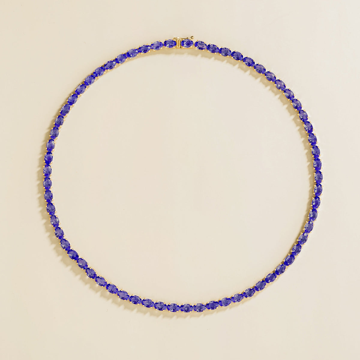 Oval lab-grown blue sapphire tennis necklace, Salto design in gold | Juvetti London