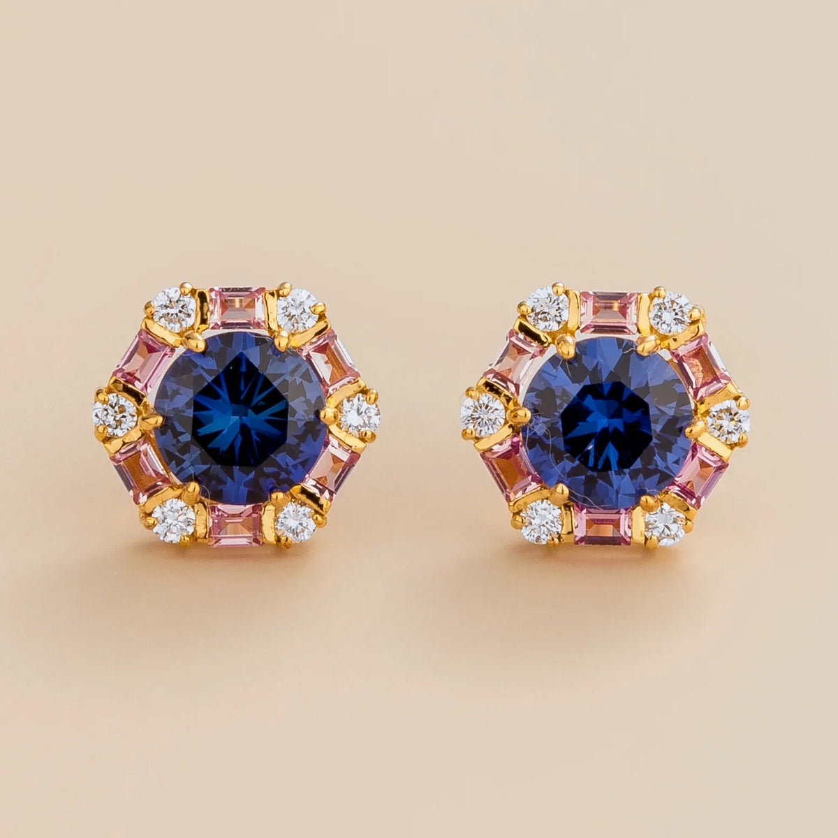 Hexagon halo lab-grown blue sapphire, pink sapphire and diamond stud earrings, Melba design in gold | Juvetti London