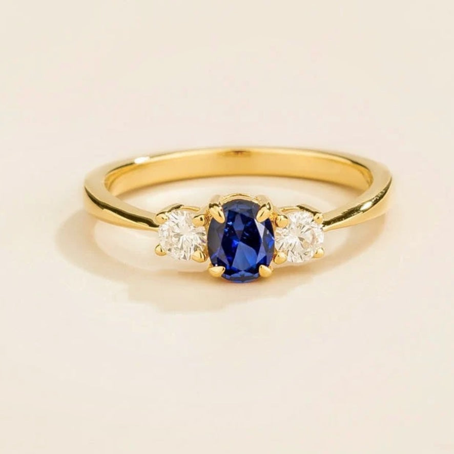 Boble blue sapphire oval & diamond three-stone ring in gold