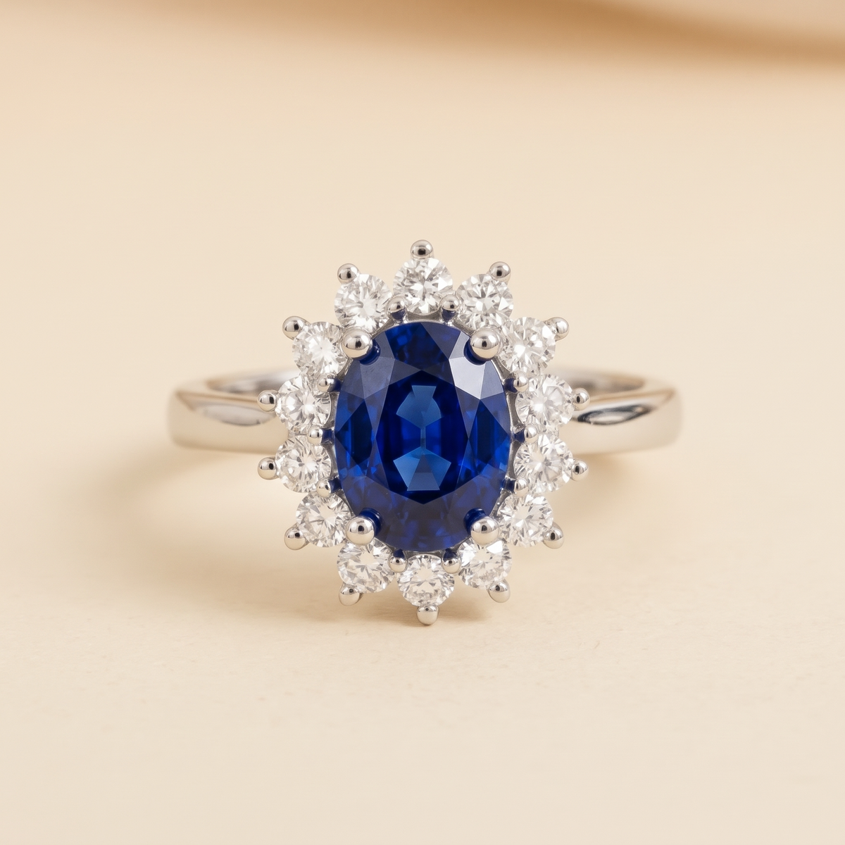 Oval lab-grown blue sapphire and diamond halo ring in white gold – front view | Divo by Juvetti