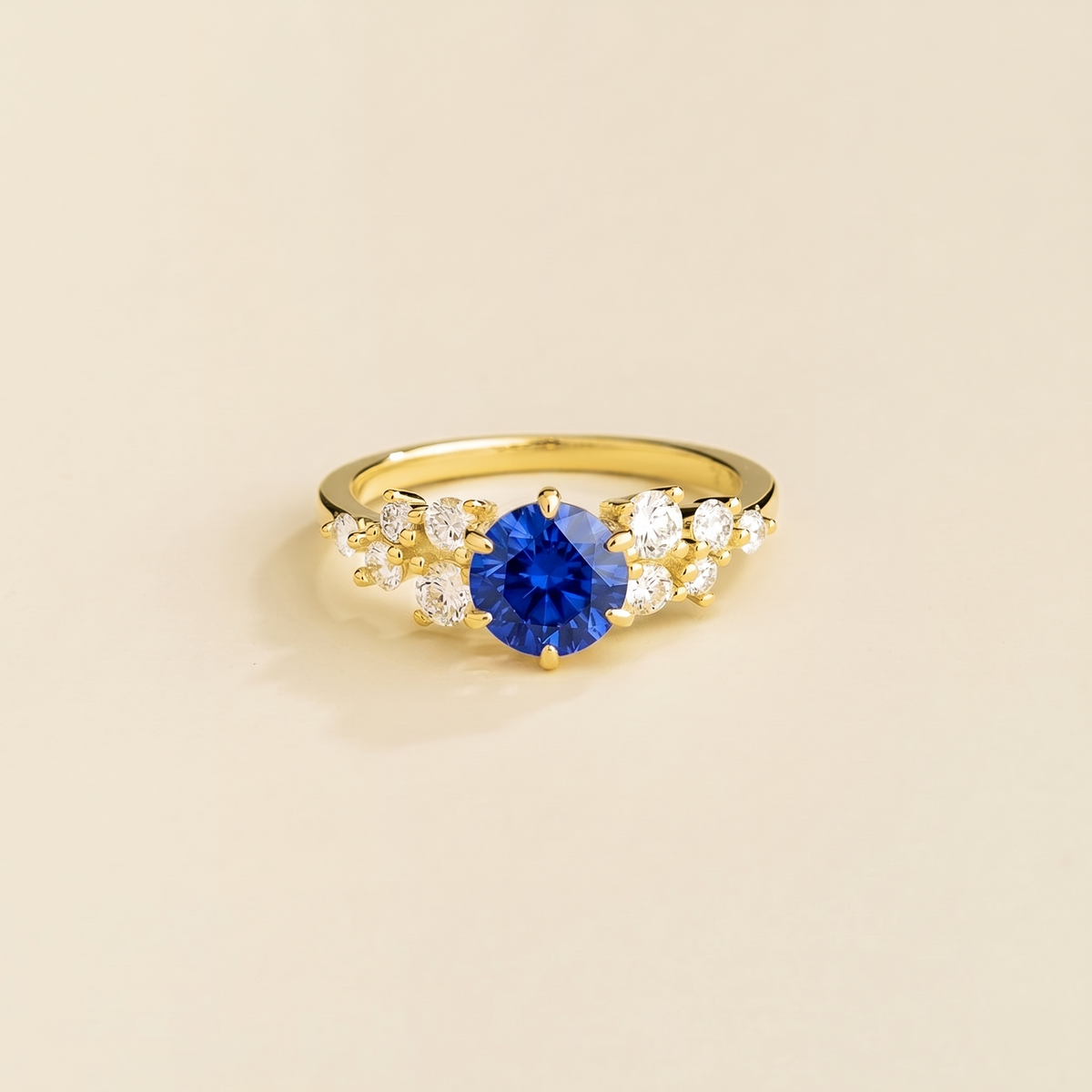 Floret round lab-grown blue sapphire and diamond cluster ring in gold – front | Juvetti London