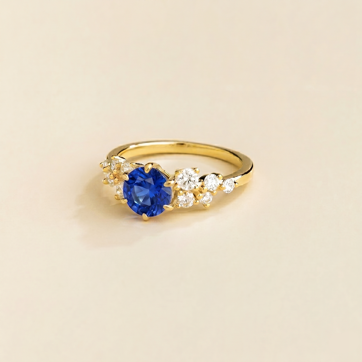 Floret round lab-grown blue sapphire and diamond cluster ring in gold – side | Juvetti London
