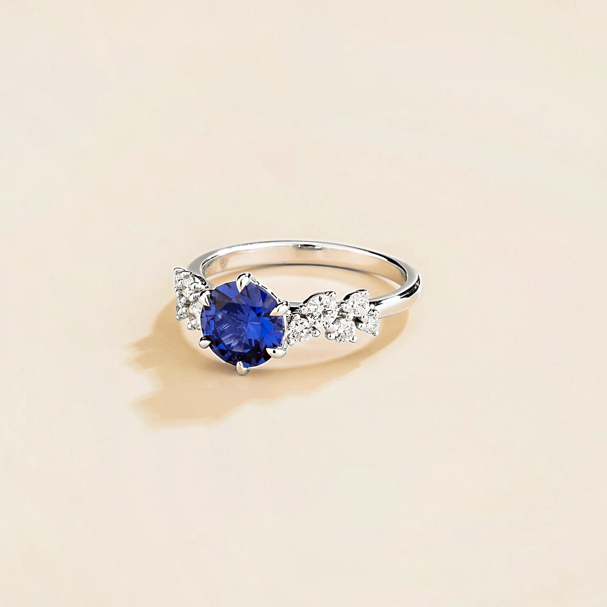Floret round lab-grown blue sapphire and diamond cluster ring in white gold – side | Juvetti London