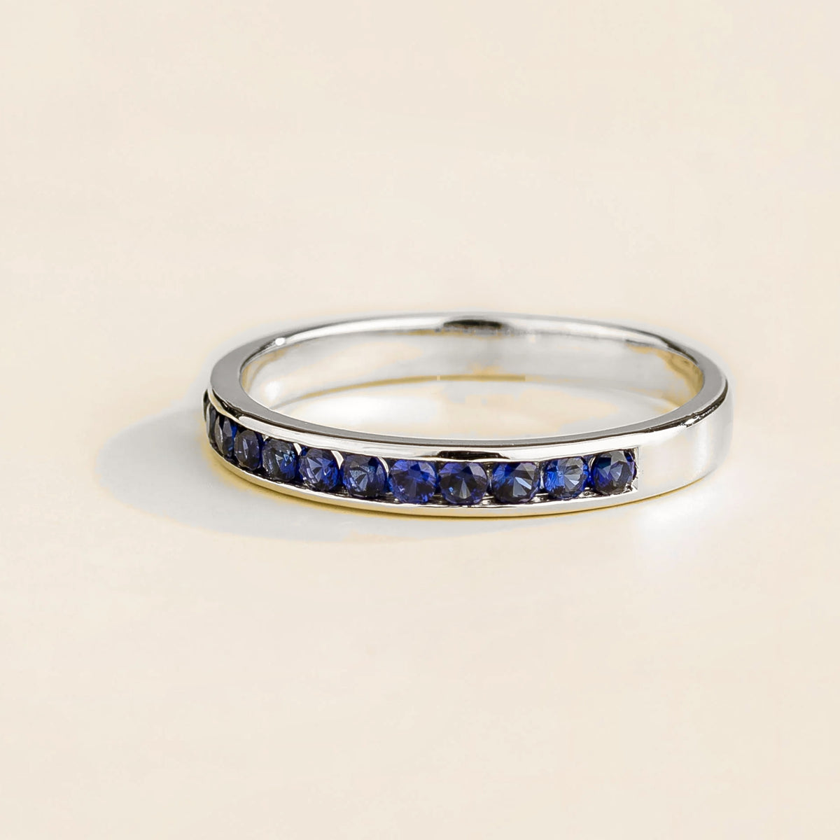 Margo Blue Sapphire Channel Band Ring in White Gold – angle view