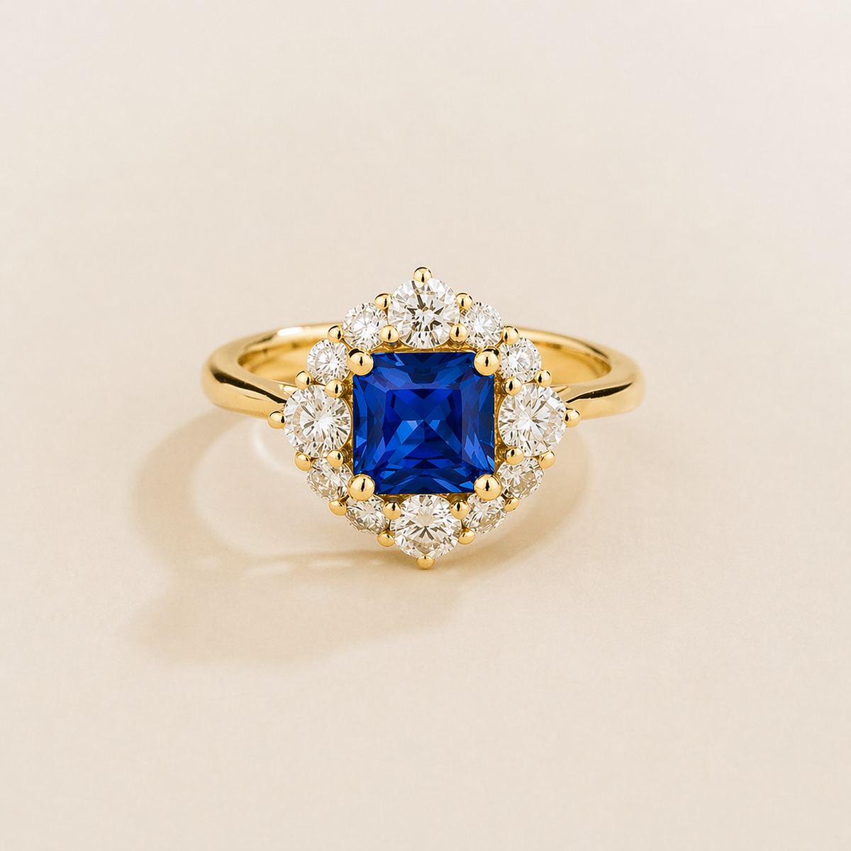 Tuli cushion-cut lab-grown blue sapphire and diamond halo ring in gold – front view | Juvetti London