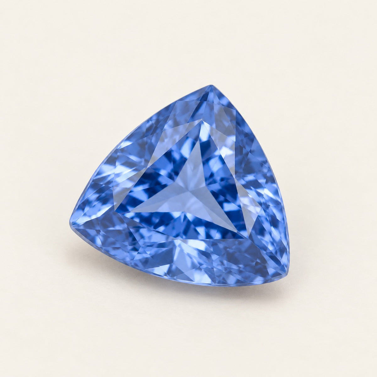 Cornflower blue lab-grown sapphire, trillion cut, 45° view
