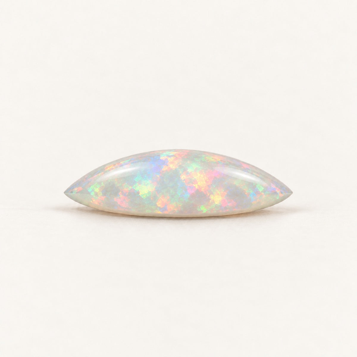 Crystal lab-grown opal, marquise cabochon, side view