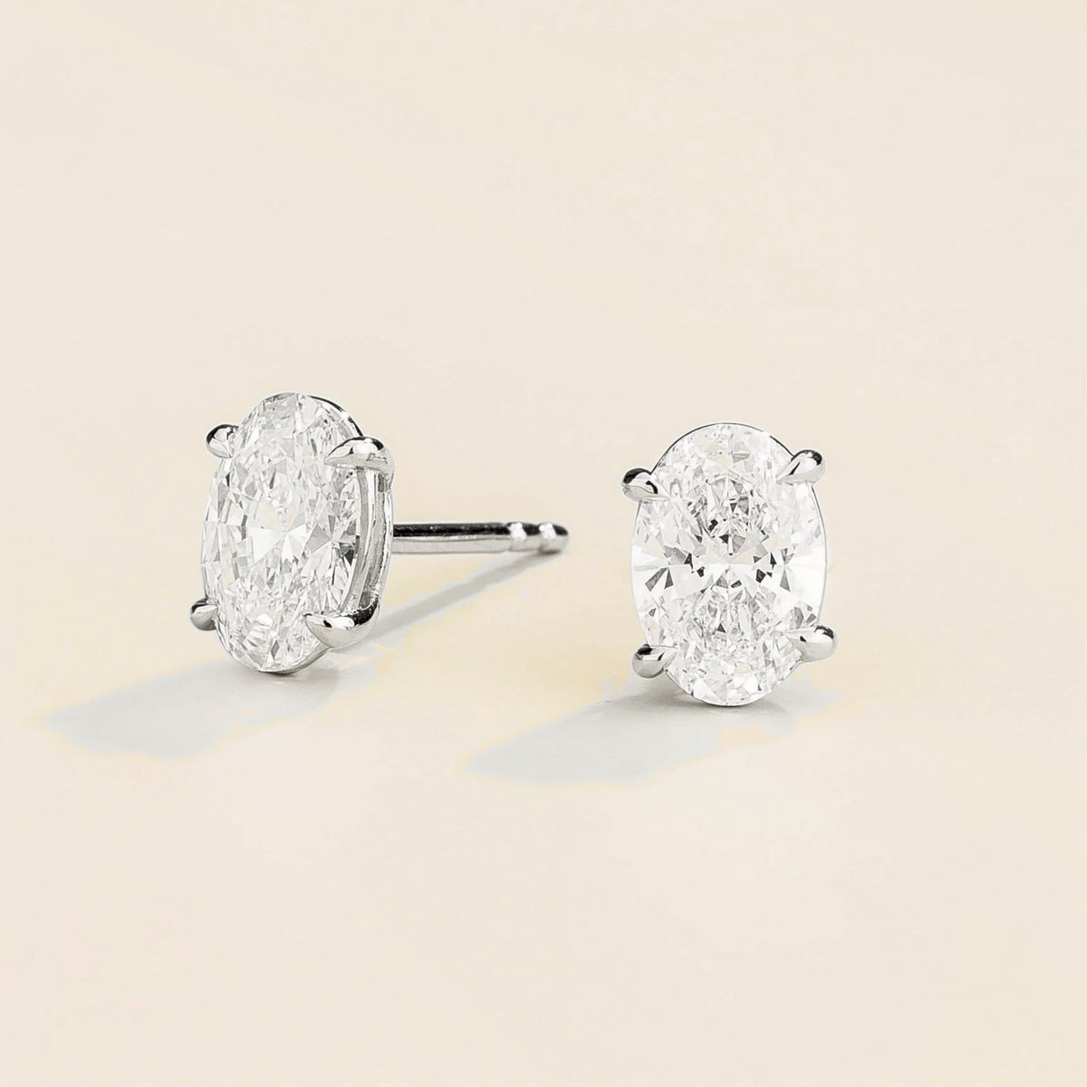 Ovo Diamond Oval Stud Earrings in White Gold – angle view