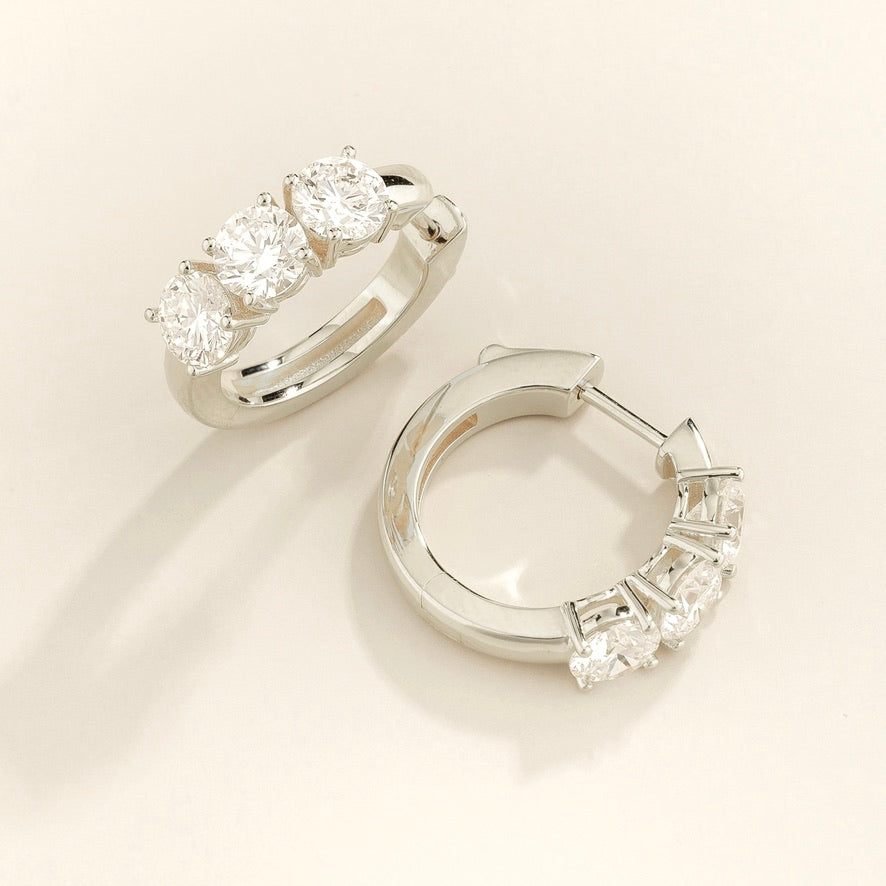 Tres Diamond Three-Stone Huggie Hoops in White Gold – angle view