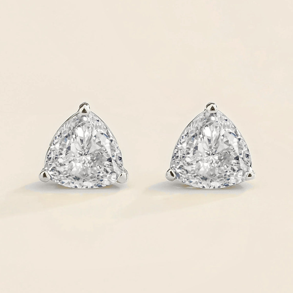 Trillion diamond solitaire stud earrings in white gold
