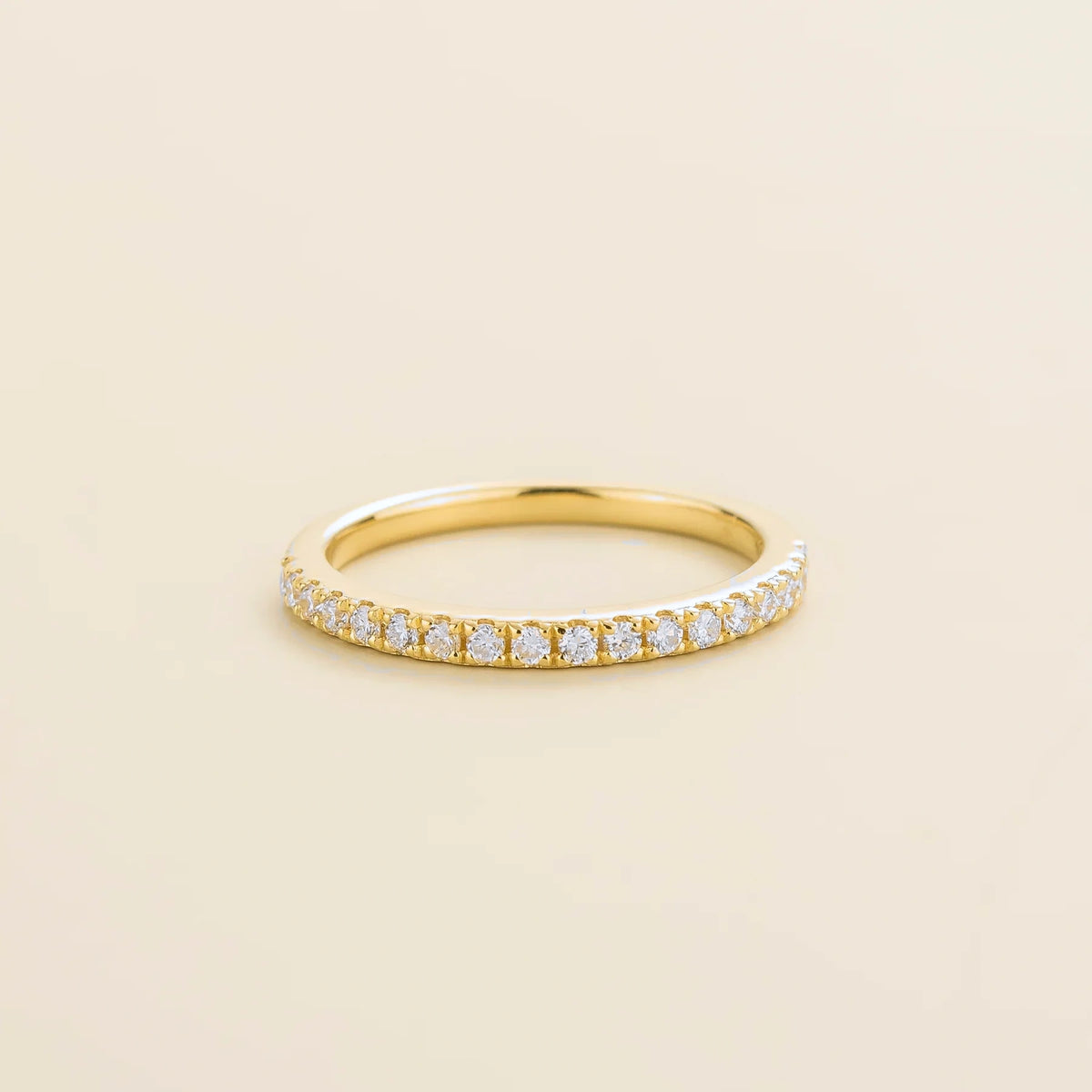 Juvetti yellow gold half eternity band set with round lab-grown diamonds.
