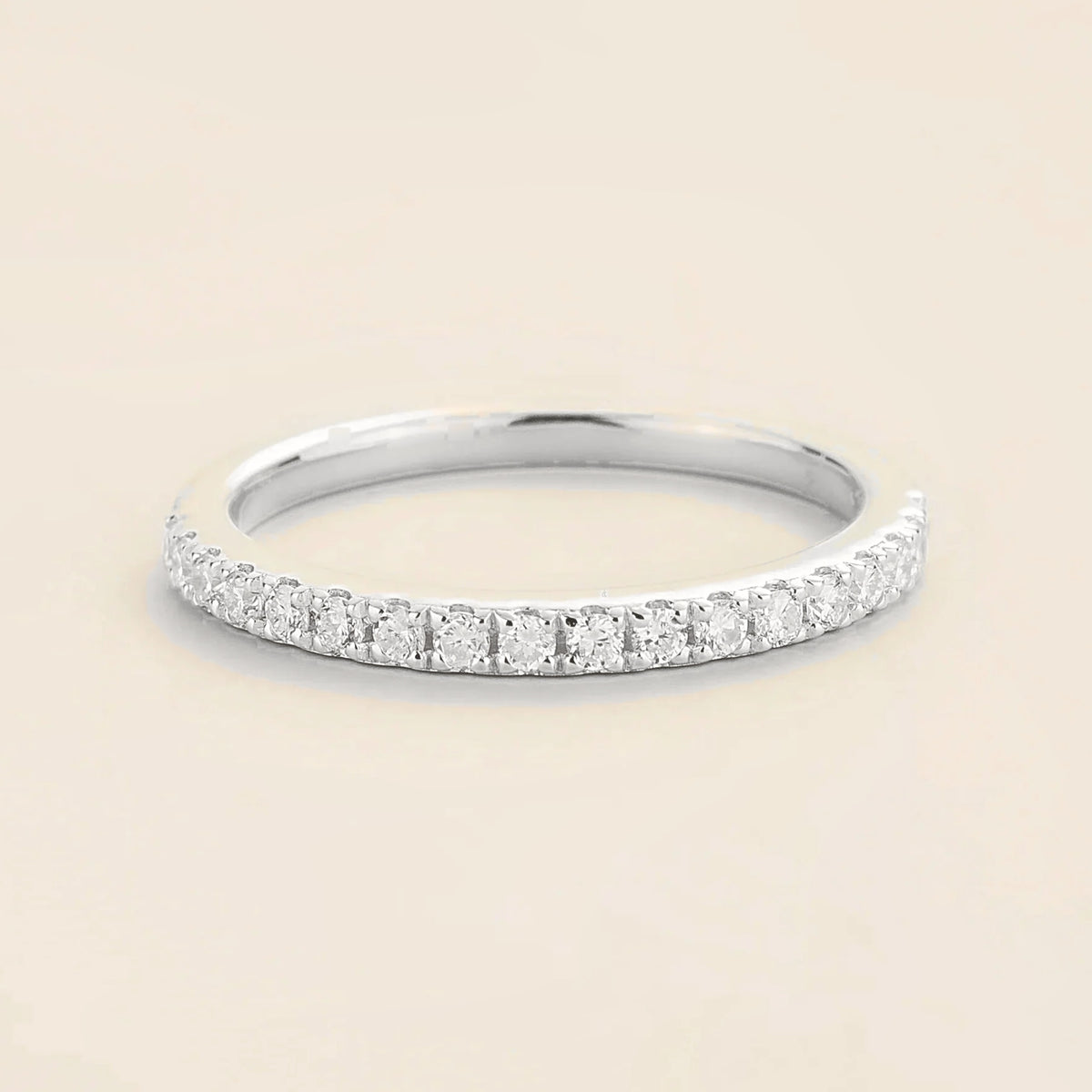 Juvetti white gold half eternity band set with round lab-grown diamonds.
