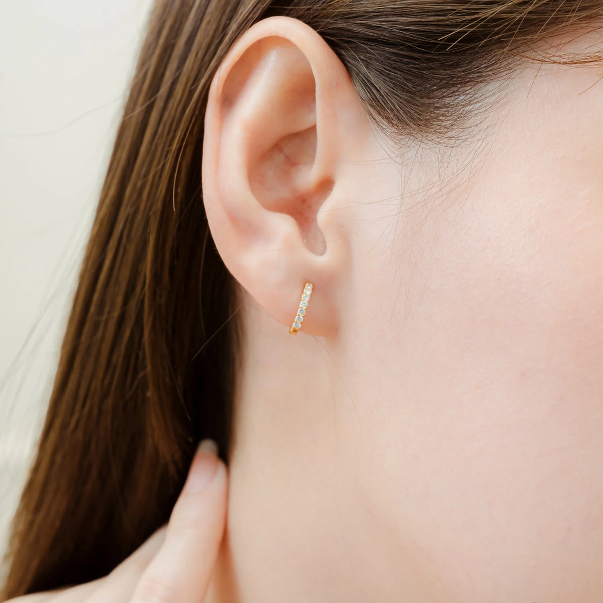 Stacy Mini Diamond Huggie Hoop Earrings in Gold – close-up