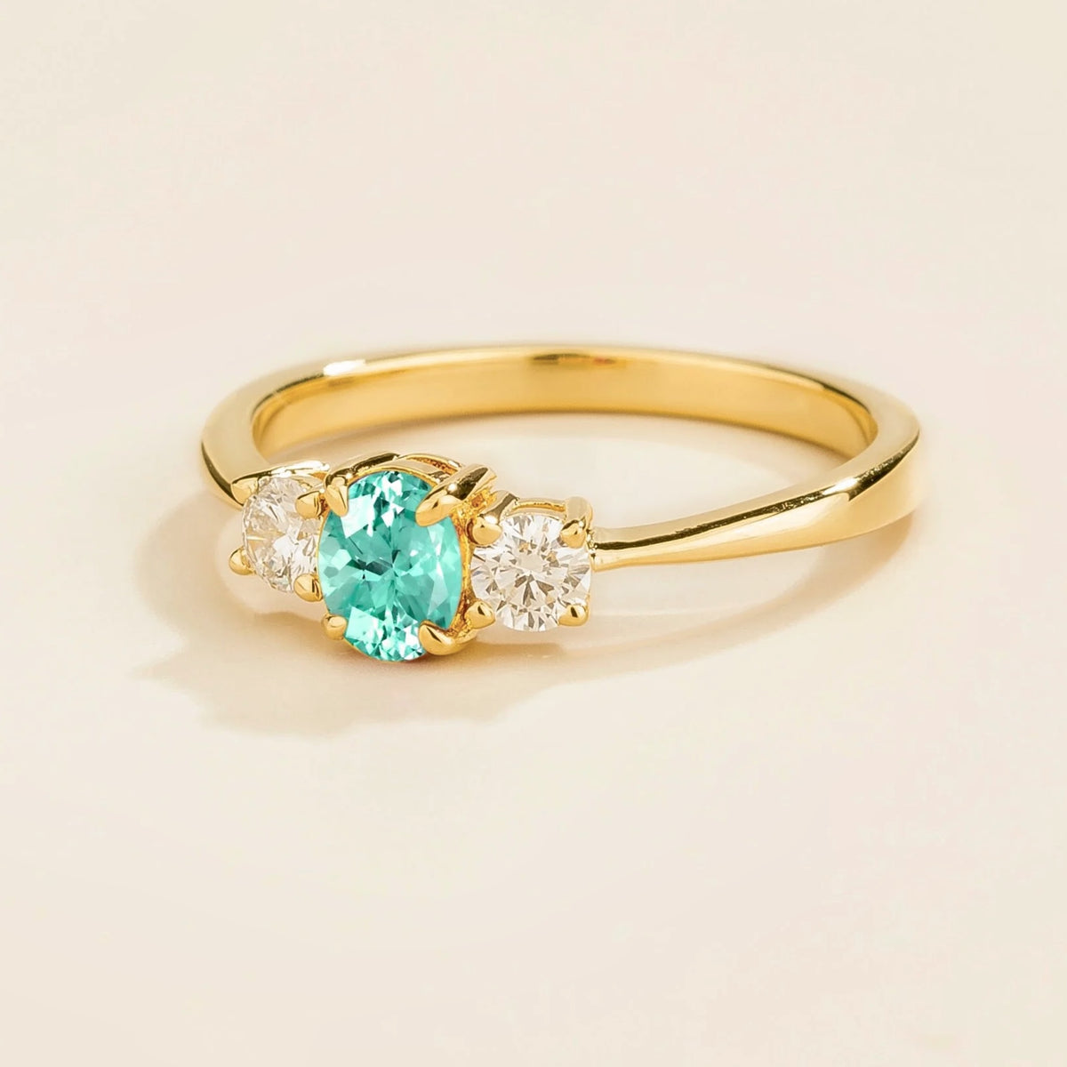 Boble Paraiba Oval & Diamond Three-Stone Ring in Gold – angle view