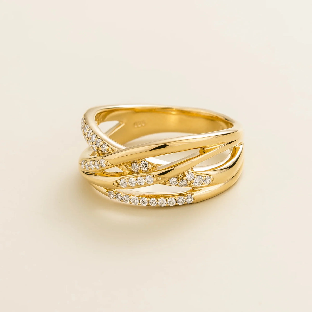 Val multi-row crossover band ring with lab-grown diamonds in gold – angle view | Juvetti London