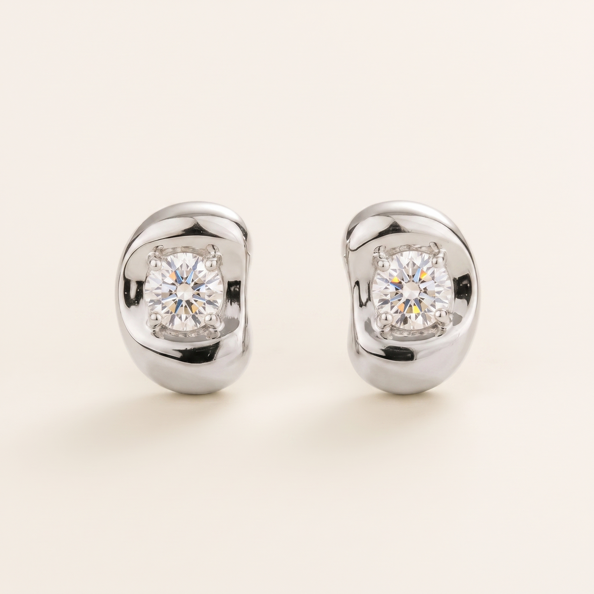 Fava round lab-grown diamond stud earrings in white gold, sculpted pebble setting, front view | Juvetti London