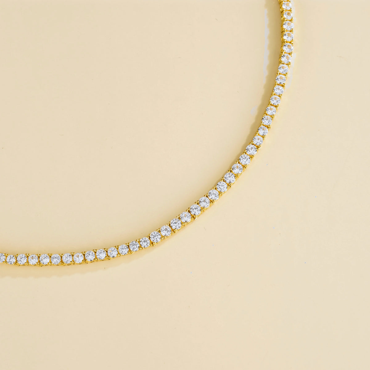 Stacy round tennis necklace in gold, angle view