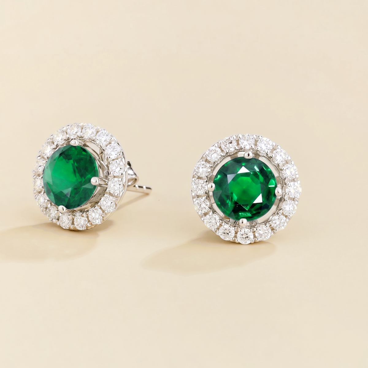 Floret round lab-grown emerald and diamond halo stud earrings in white gold – side | Juvetti London