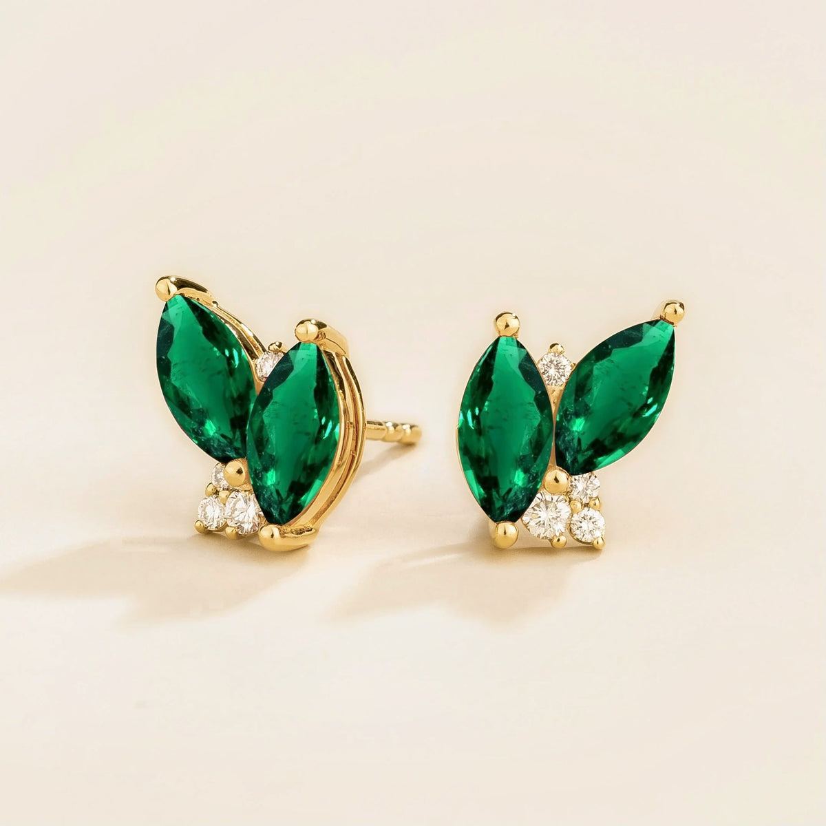 Vento Marquise Emerald & Diamond Cluster Stud Earrings in Gold – angle view