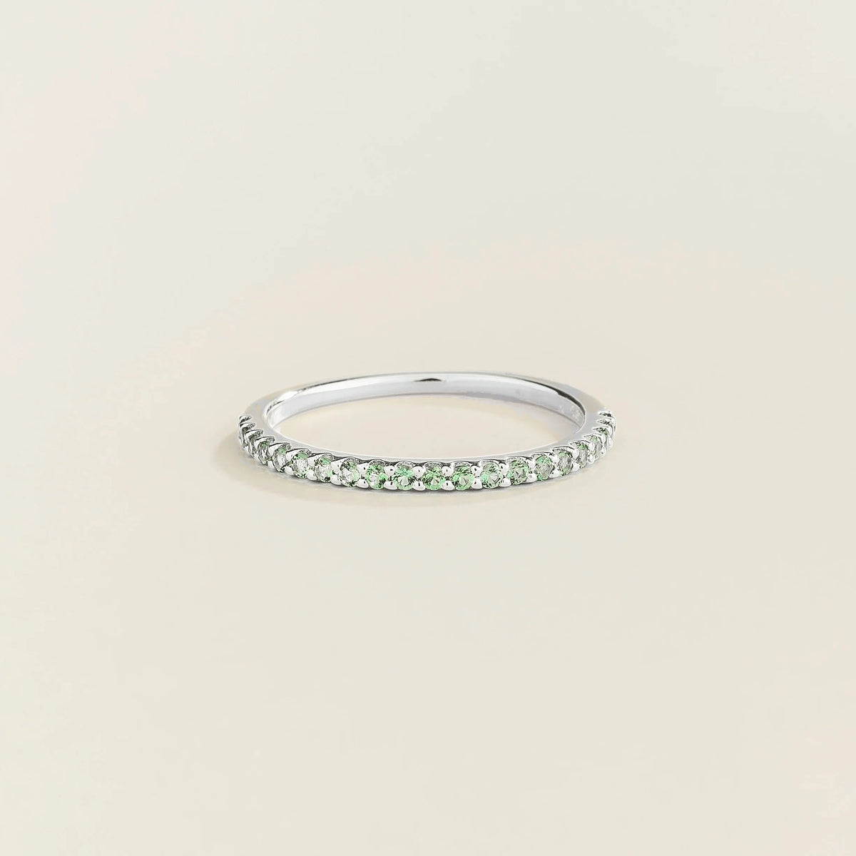 Stacy emerald half eternity band in white gold