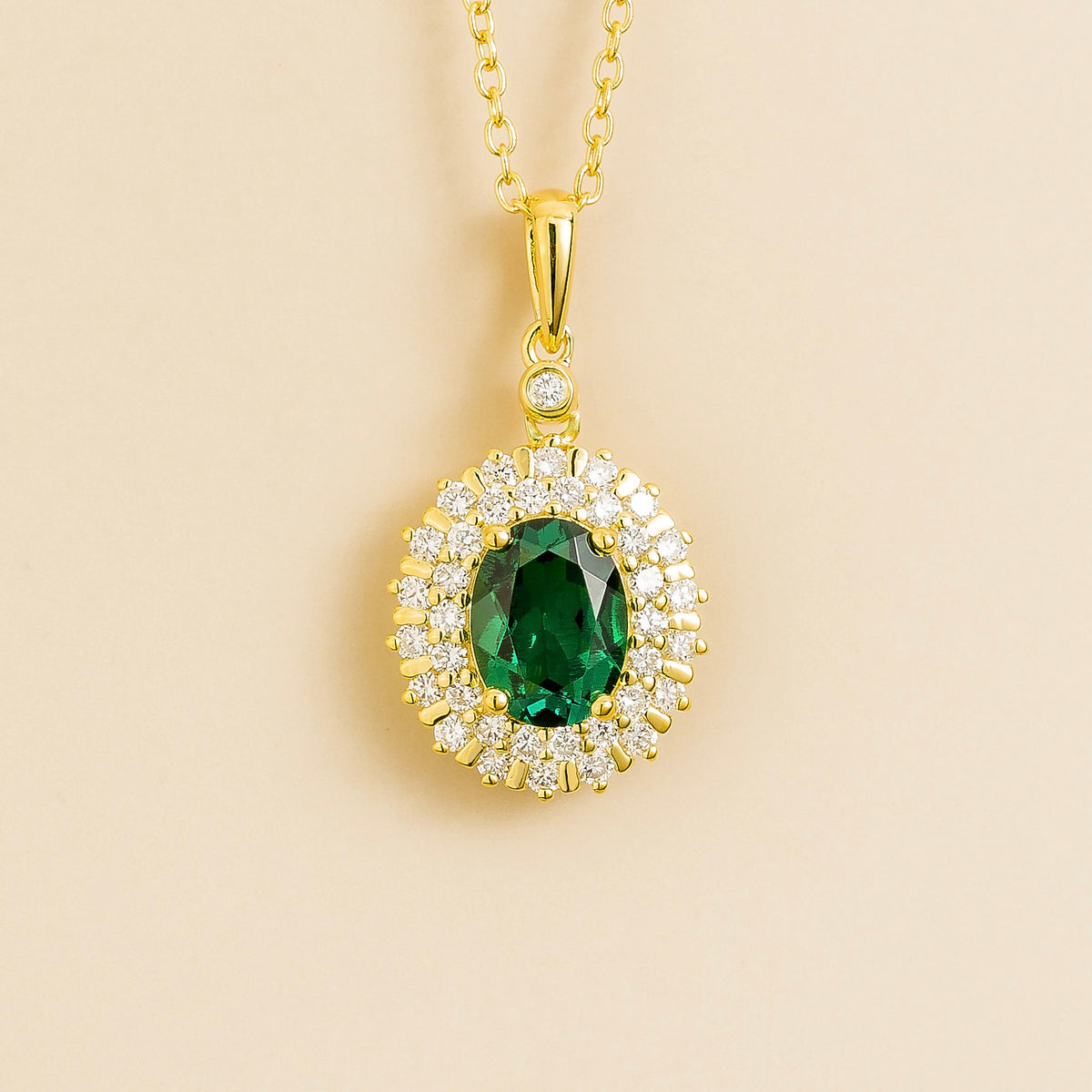 Viva oval lab-grown emerald and diamond double halo pendant necklace in gold | Juvetti London