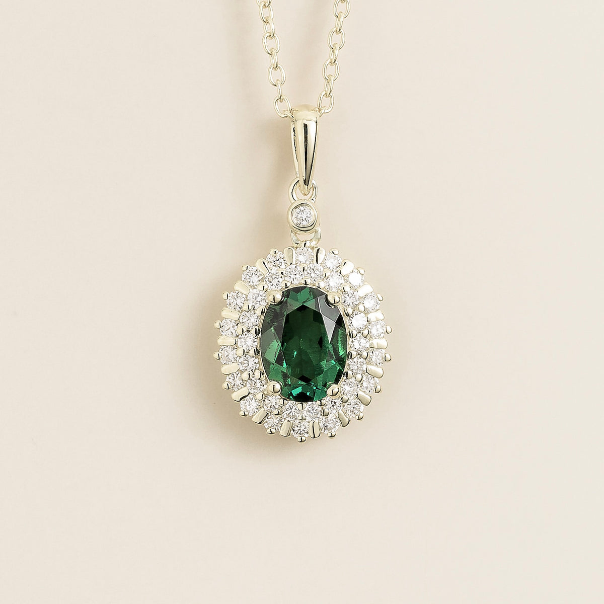 Viva oval lab-grown emerald and diamond double halo pendant necklace in white gold | Juvetti London