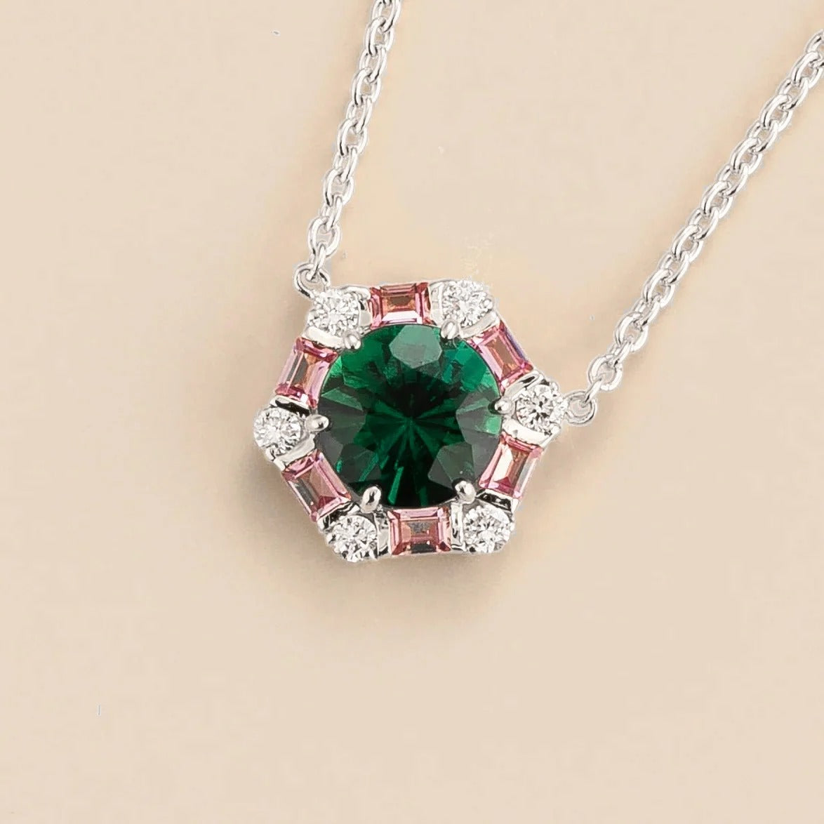 Melba Emerald, Pink Sapphire & Diamond Halo Hexagon Pendant Necklace in White Gold – angle view
