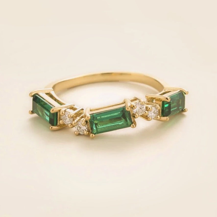Forma emerald & diamond baguette three-stone ring in gold