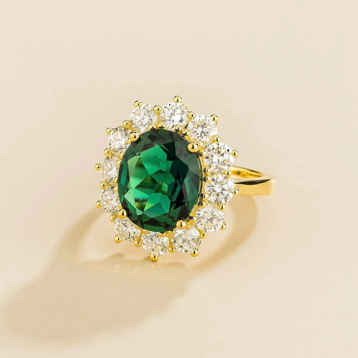 Oda Oval Emerald & Diamond Halo Ring in Gold – angle view
