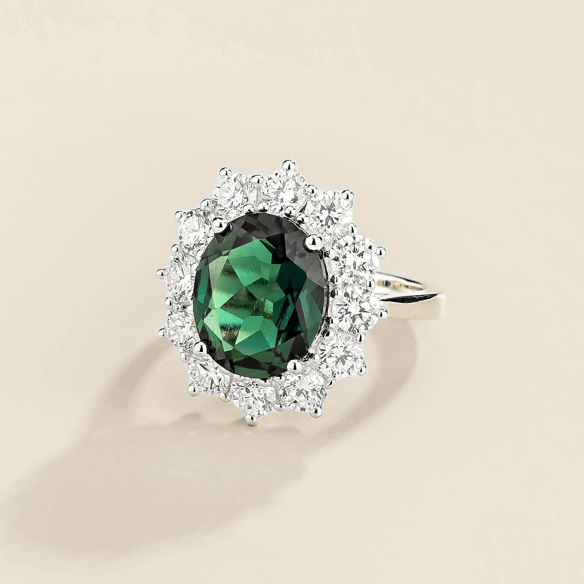 Oda Oval Emerald & Diamond Halo Ring in White Gold – angle view
