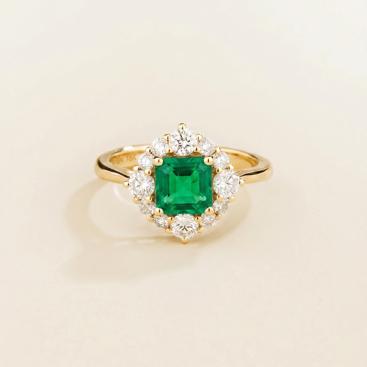 Tuli cushion-cut lab-grown emerald and diamond halo ring in gold – front view | Juvetti London