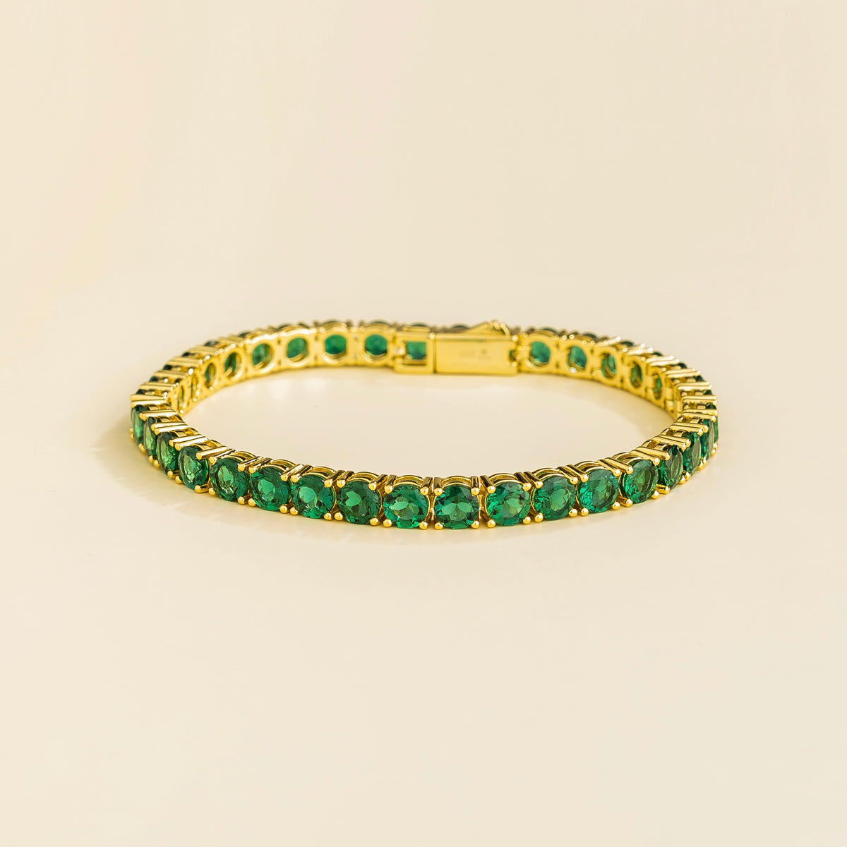 Round Emerald Tennis Bracelet in Gold