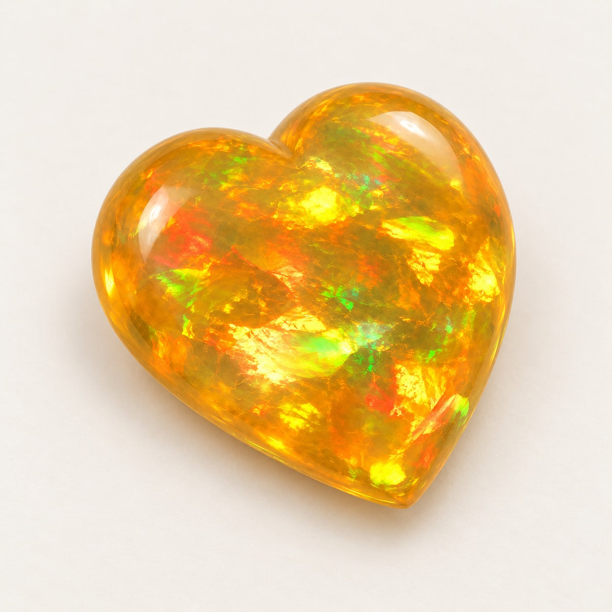 Fire lab-grown opal, heart cabochon, 45° view