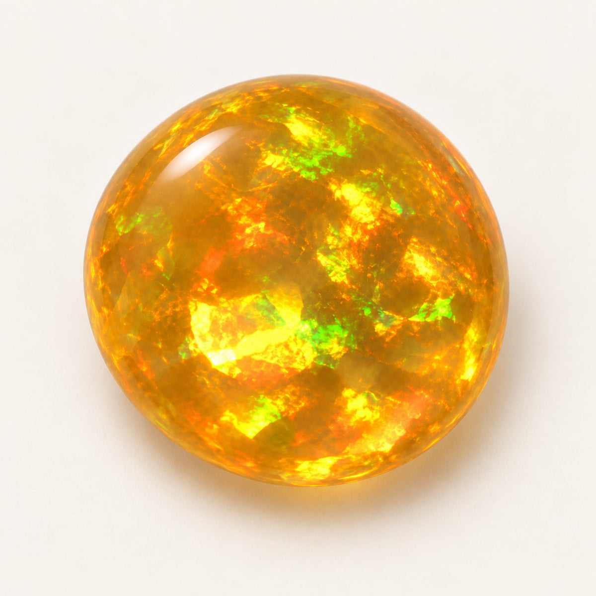 Fire lab-grown opal, round cabochon, 45° view