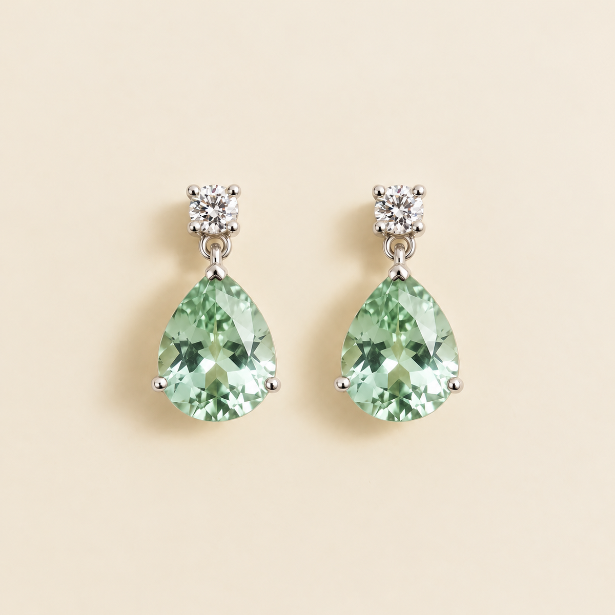 Medium lab-grown green sapphire and diamond pear drop earrings in white gold – front view | Pisa by Juvetti