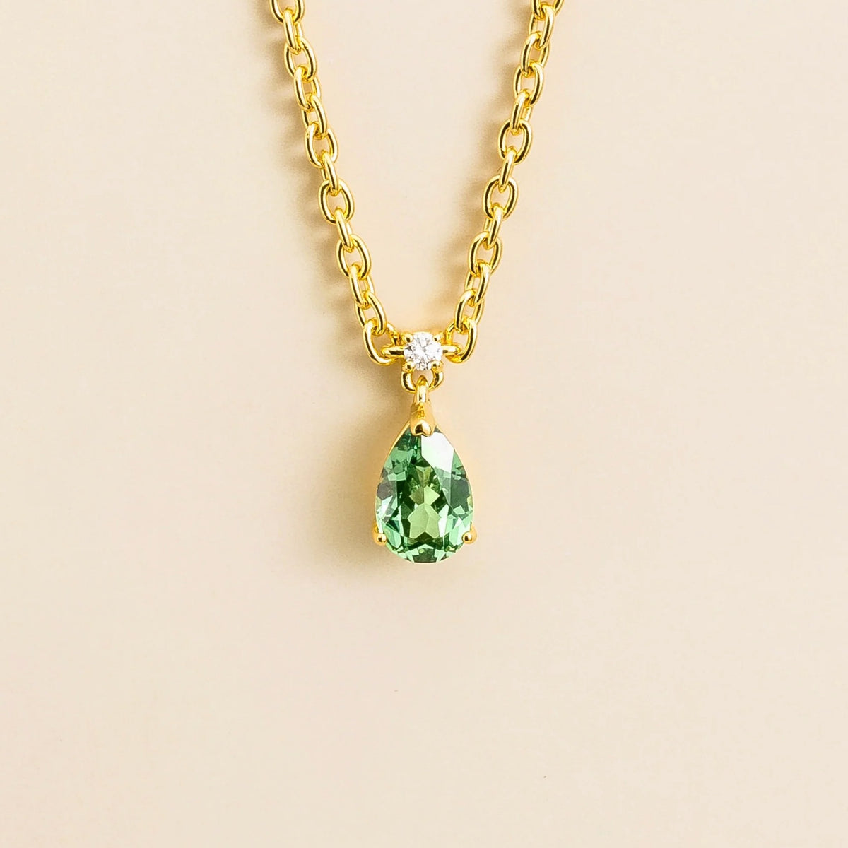 Lab-grown green sapphire and diamond pear drop pendant necklace in gold, small – front view | Pisa by Juvetti