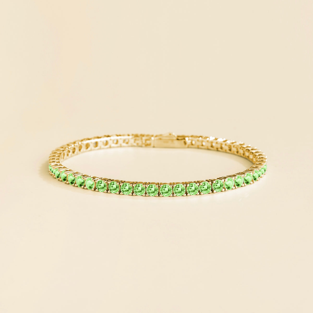 Stacy green sapphire round tennis bracelet in gold