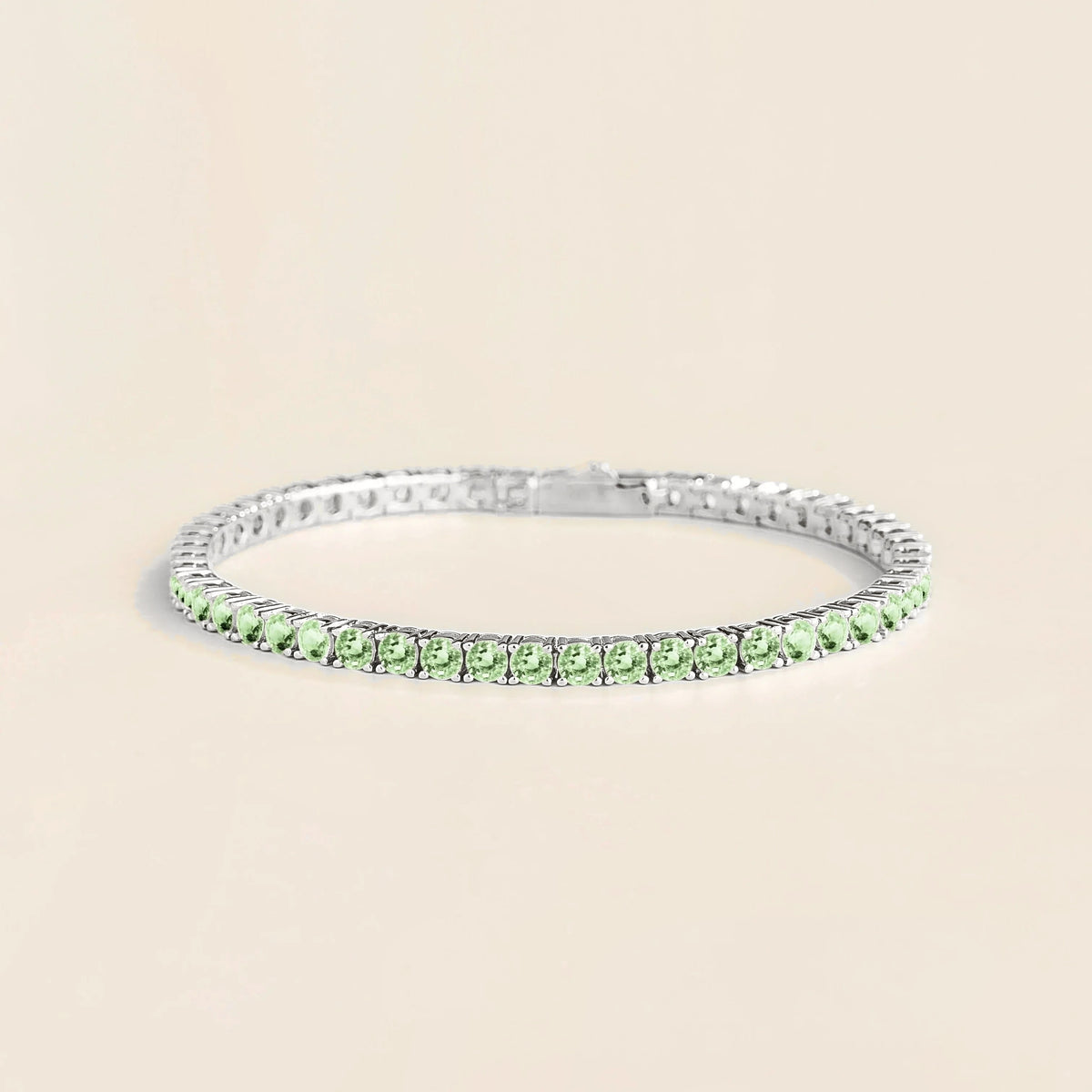 Stacy green sapphire round tennis bracelet in white gold