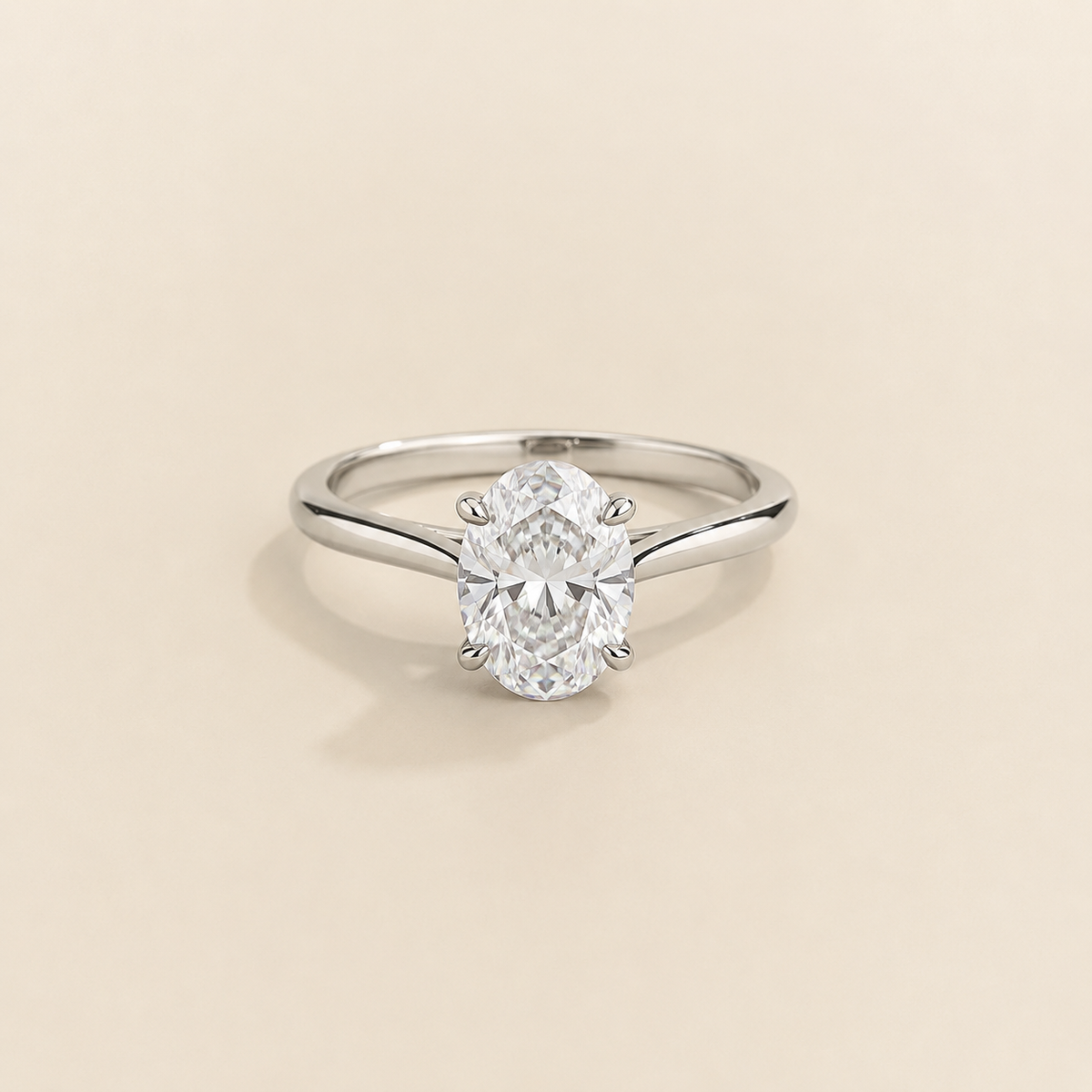 Kissen Ring in white gold, set with a Oval cut Diamond in an east–west setting.