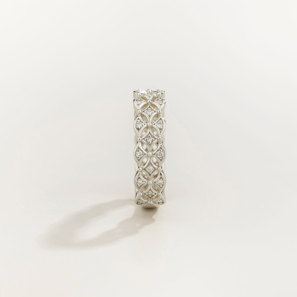 Padre openwork floral diamond eternity ring in white gold, lab-grown diamonds in each flower, angled view