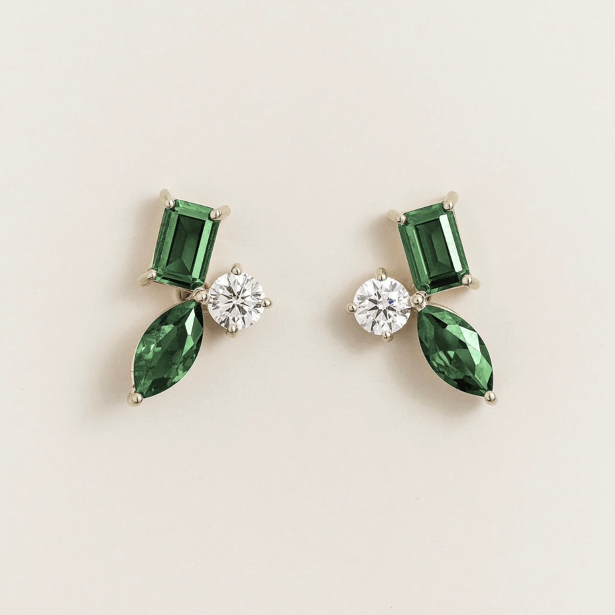 Sanka emerald cluster stud earrings in white gold: baguette and marquise lab-grown emeralds, round diamond