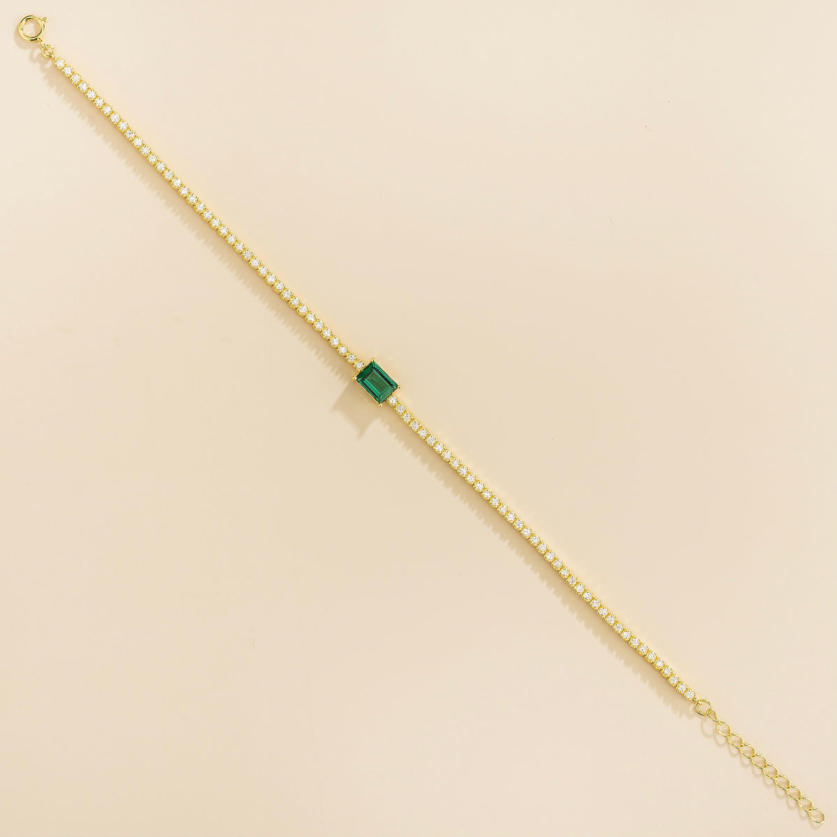 Mesa emerald-cut lab-grown emerald and diamond tennis bracelet in gold, on wrist