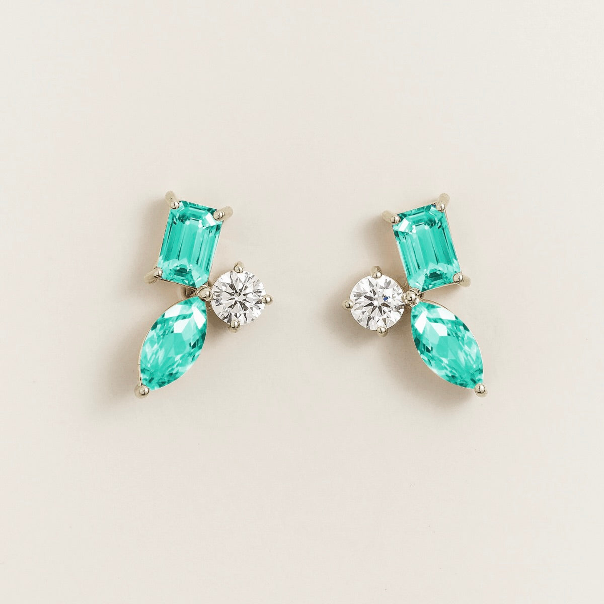 Sanka Paraiba sapphire cluster stud earrings in white gold: baguette and marquise lab-grown sapphires, round diamond