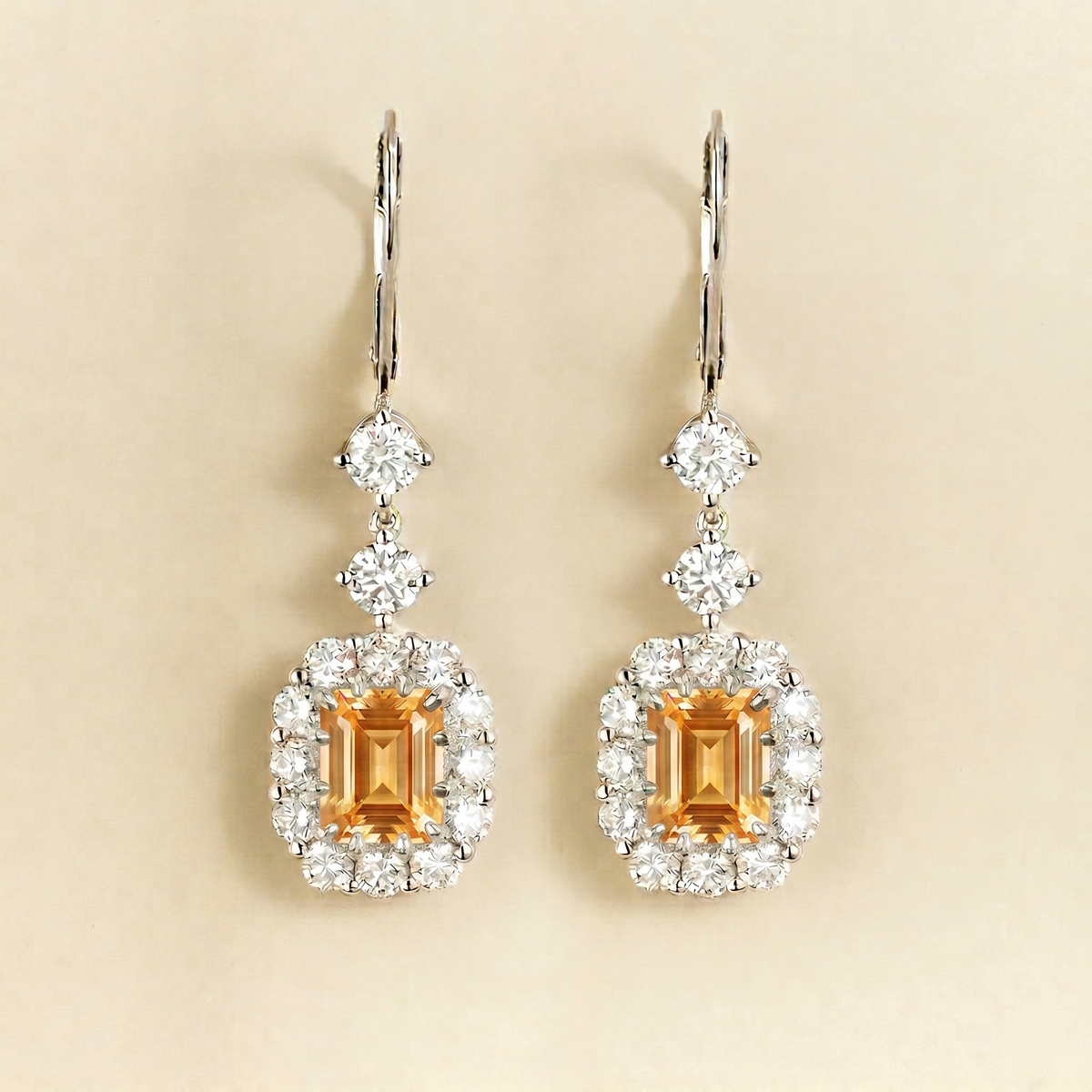 Pippa emerald-cut yellow sapphire and diamond halo drop earrings in white gold, lab-grown sapphires hanging from round diamonds on lever-back hooks